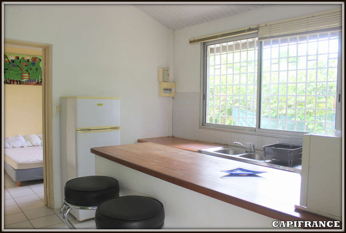 A vendre a kourou (97310) une magnifique maison en bois t5 de 106 m² avec 2 maisons t2 independantes - terrain de 775 m² - au pr - photo 20