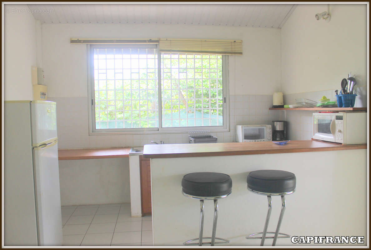 A vendre a kourou (97310) une magnifique maison en bois t5 de 106 m² avec 2 maisons t2 independantes - terrain de 775 m² - au pr - photo 19