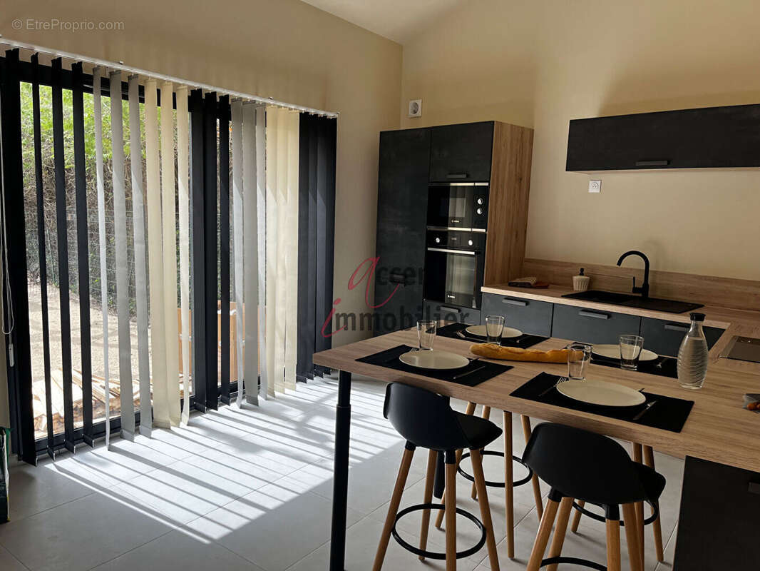 EXCLUSIVITE : Maison plain pied avec jardin T2 Bis (mezzanine) et places de parking - photo 4