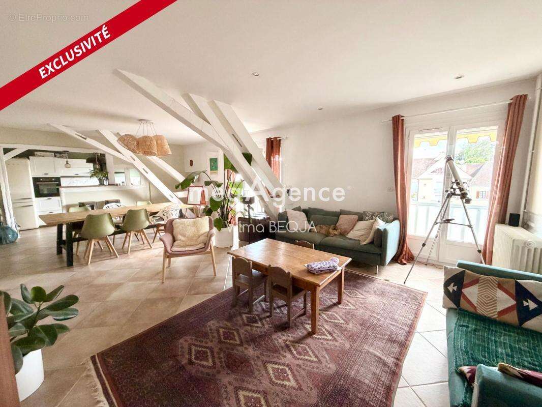 SENS – Hyper-centre  Appartement familial avec garage et jardin commun - photo 2