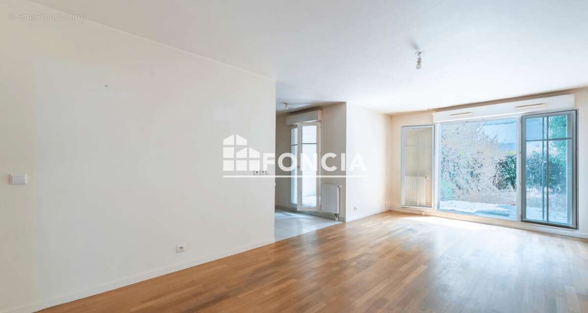 3 pieces en rez de jardin, cave et parking en sous-sol - photo 4