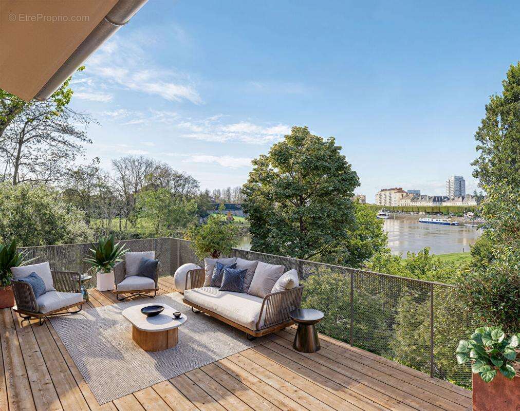 appartement 2 pièces 42m² rdc avec terrasse 13M² vue  sur  la Saône sur ile saint Laurent  Rives de Genise 1 - photo 2