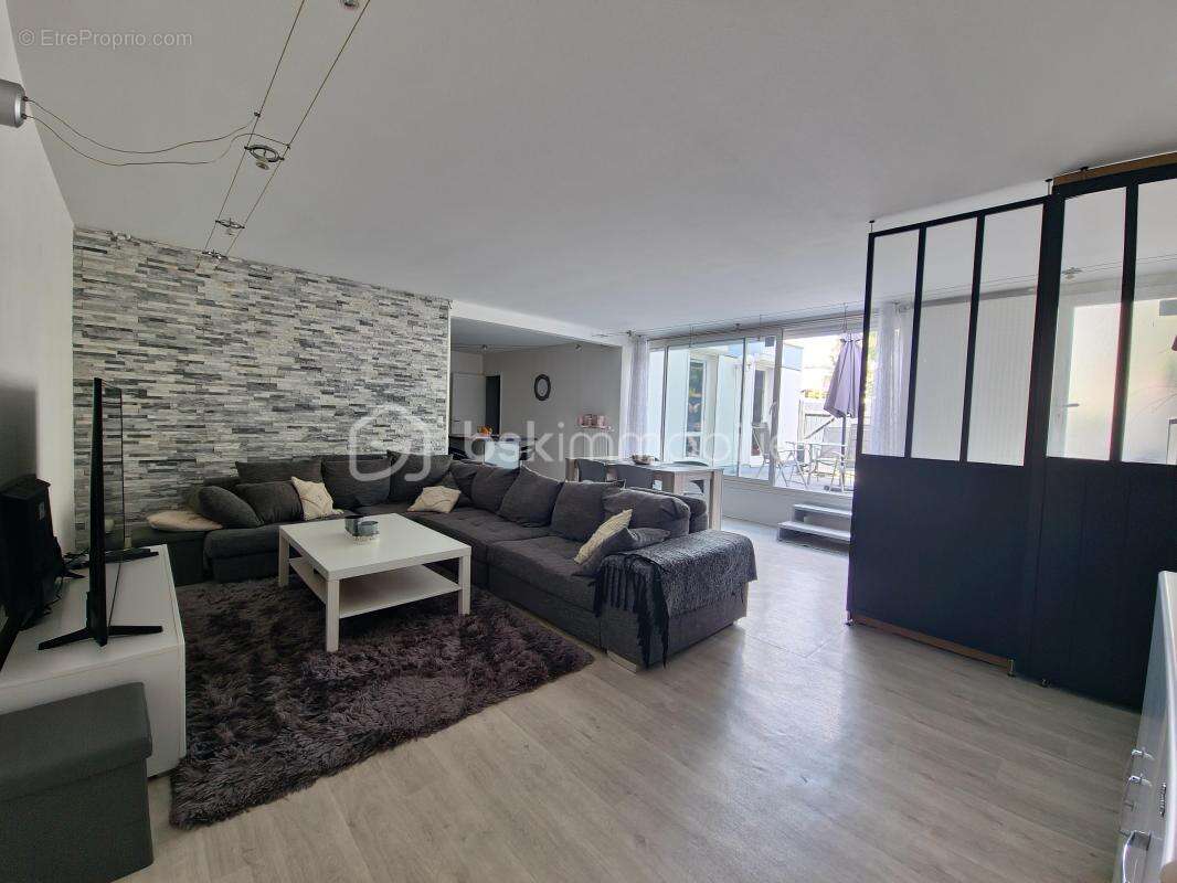 Appartement en rc de 124m² utile avec terrasse de 34m² -vue degagee- 5p lumineux et en parfait etat - photo 4