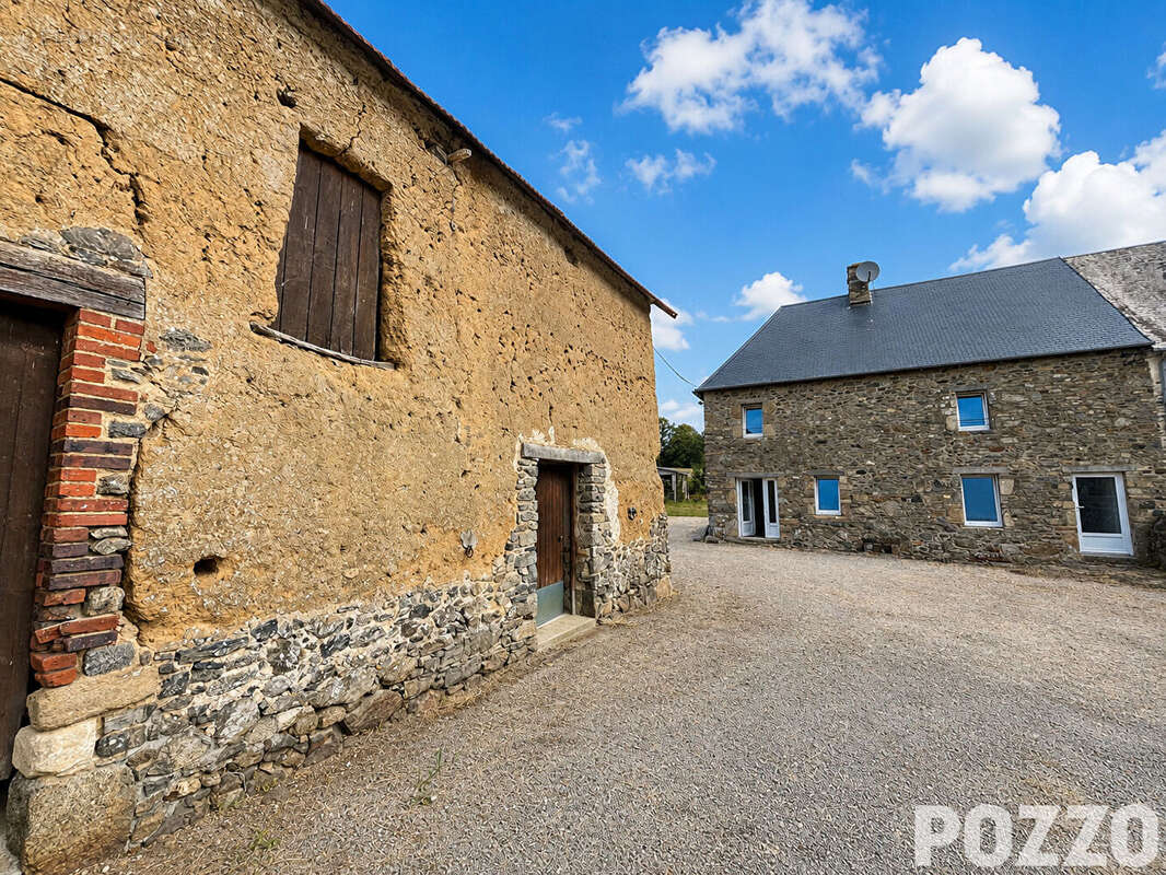 EXCLUSIVITÉ : Charmante maison en pierre à Saint-Sauveur-Villages avec beau terrain arboré et dépendances, 88.9 m2, 3ch. - photo 4