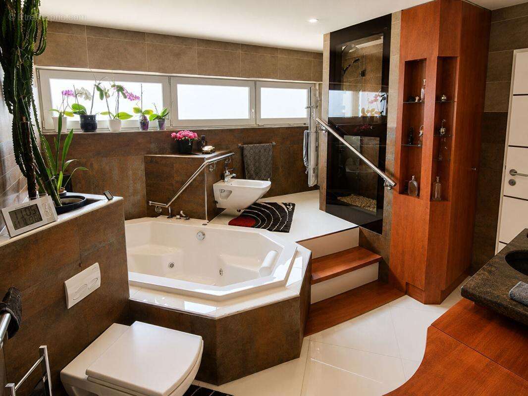 Villa d'exception de 216 m²  Prestations haut de gamme  Potentiel d'agrandissement de 108 m² - photo 12