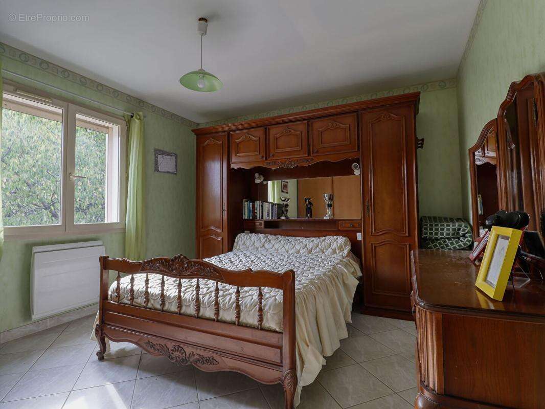 Maison de plain-pied de 110 m² - 3 chambres - Garage - Véranda -Terrain de 682 m² - photo 9