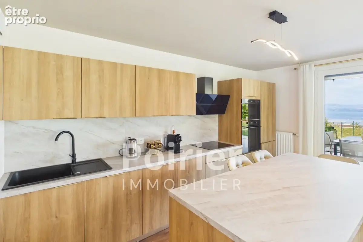 Appartement rénové de type 3 à EVIAN avec jardin vue lac et stationnements - photo 3