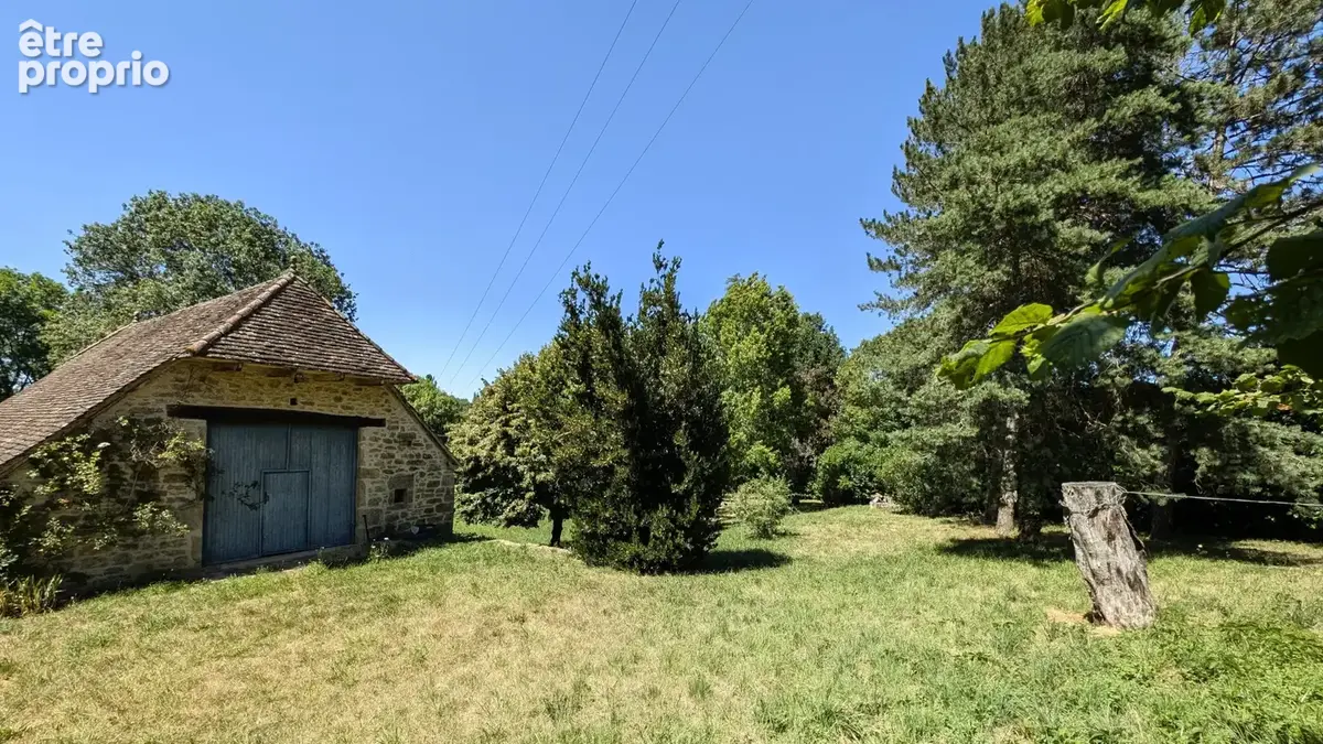 Maison en pierre et sa grange sur terrain arboré - photo 4