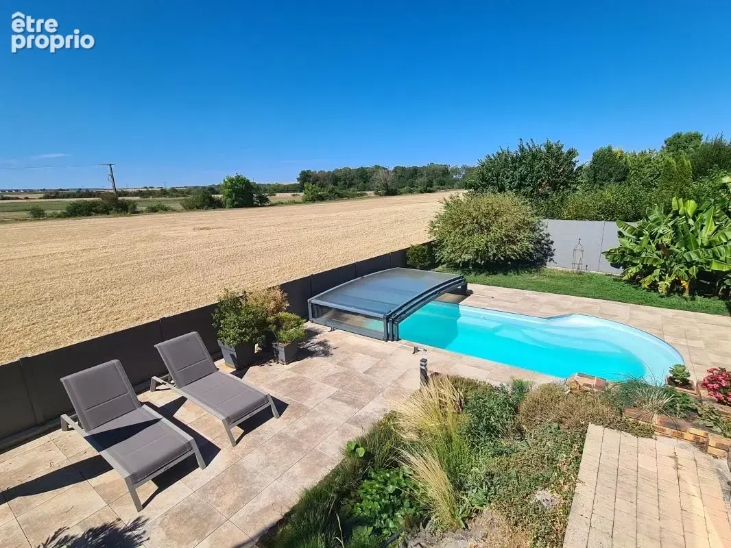 Maison avec sous-sol - 3 chambres et 2 bureaux - Terrain 730 m² avec piscine - photo 4
