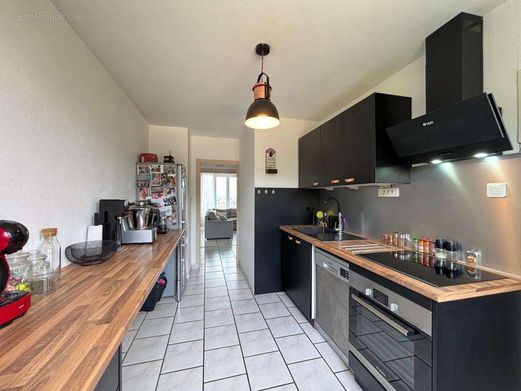 Appartement T4 de 75 avec balcon et cave - photo 2