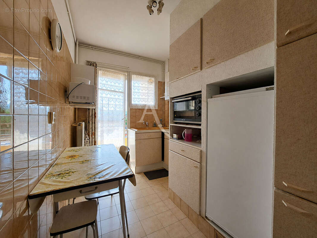 Appartement 4 pièces-Centre-ville- traversant- Parking s/s -cave - photo 6