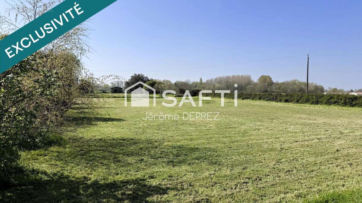 Photo 4 - Terrain à LES MAGNILS-REIGNIERS