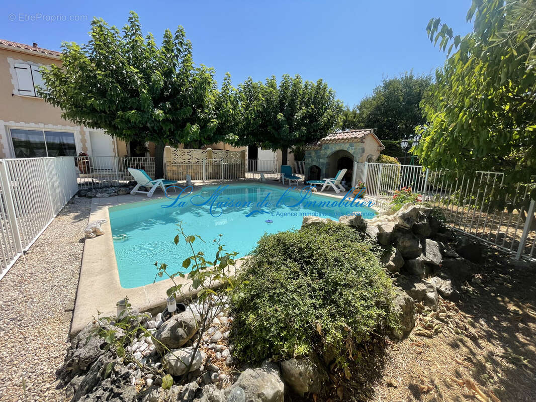 SAINT CHRISTOL LES ALES, en fond d'impasse, charmante villa de tpe F66 de 148 m2 hab avec piscine et garage de - photo 11