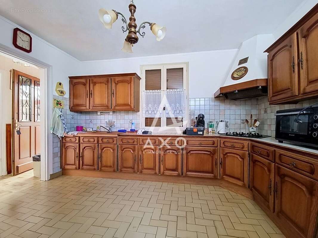 Maison en brique à Auneuil avec 2 chambres, véranda et jardin clos - photo 4