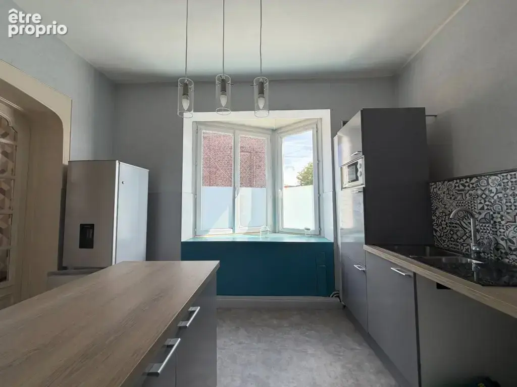 Immeuble de rapport comprenant un local commercial et un appartement - photo 2