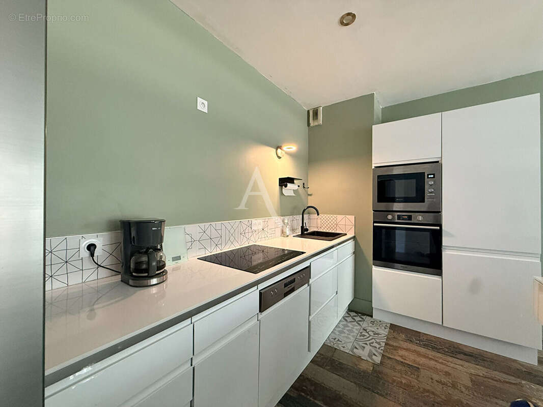 Appartement T4 de 90m² proche place du commando - photo 3