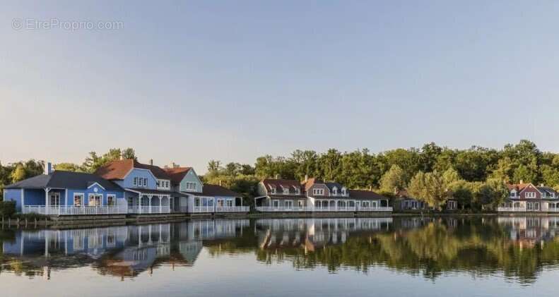 INVESTISSEMENT LOCATIF  CHAMOUILLE  Résidence de tourisme Center Parcs Le Lac d'Ailette - 7 % de rentabilité - photo 18