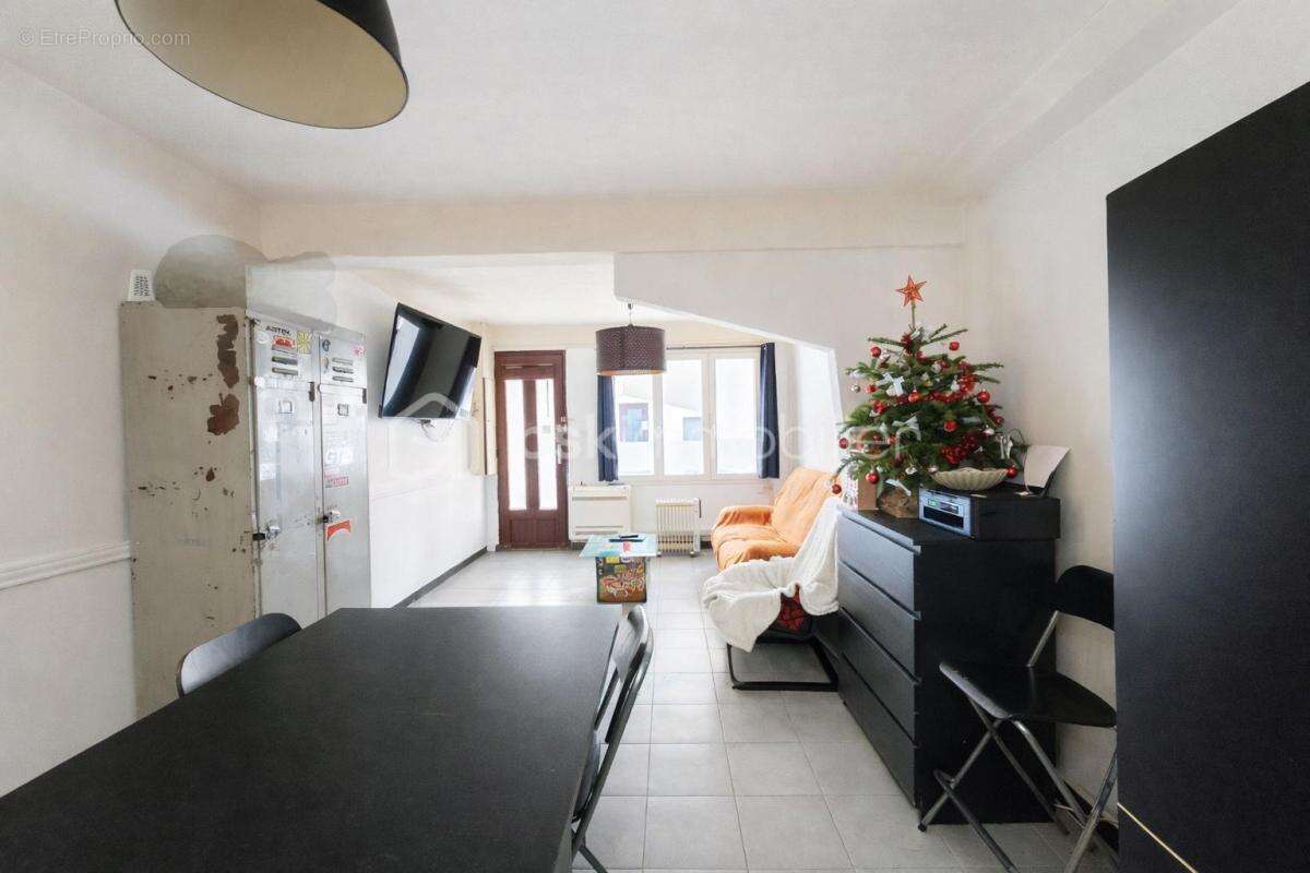 En exclusivite - rez-de-chaussee- centre-ville - photo 3