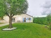 Photo 1 - Maison à CASTELNAU-MONTRATIER