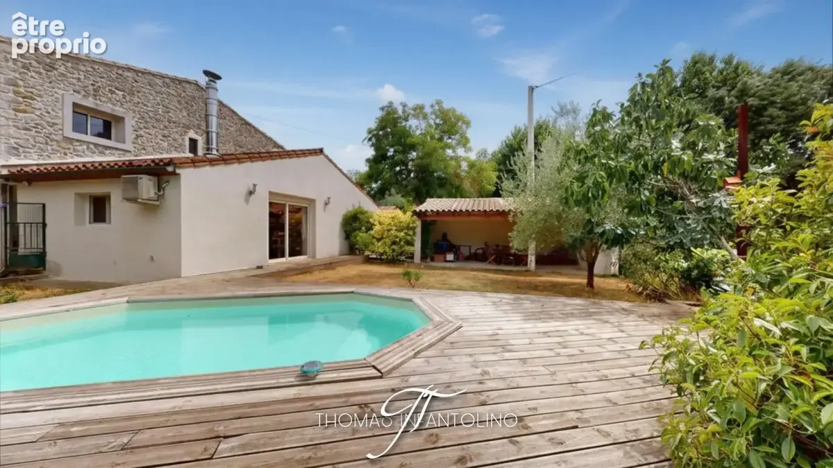 En exclusivite - maison en pierre - jardin - piscine - garage - climatisation - faible taxe foncière - photo 4