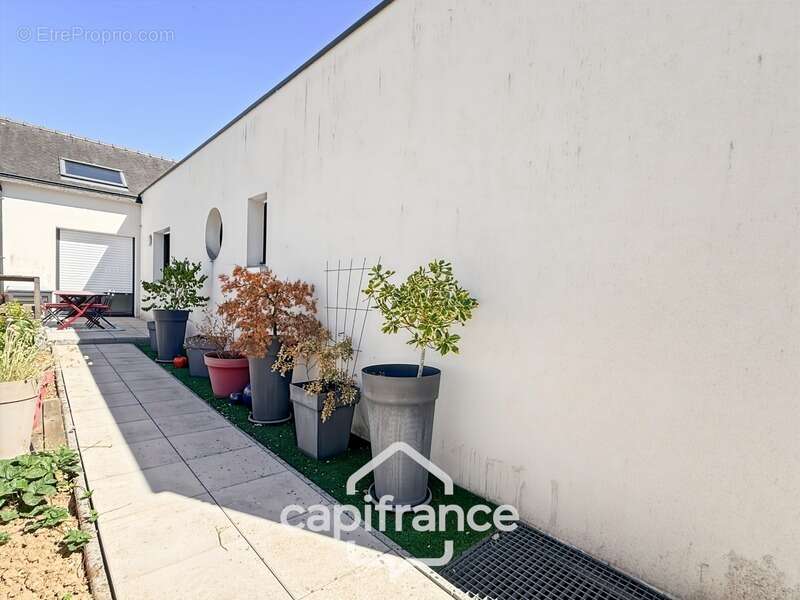 Maison contemporaine de plain-pied de 160 m² – 4 chambres – Véranda de 27 m² avec spa – Double garage – Carport – Noyal-Pontivy - photo 32