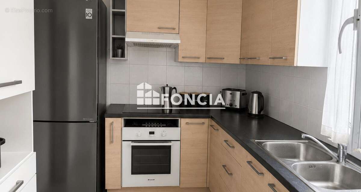 Appartement T3 avec balcon et 2 parking privatifs - photo 3