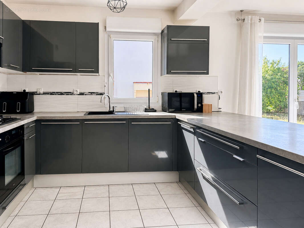 Maison familiale de 125m2 - 4 chambres - quartier certé à trignac - photo 5