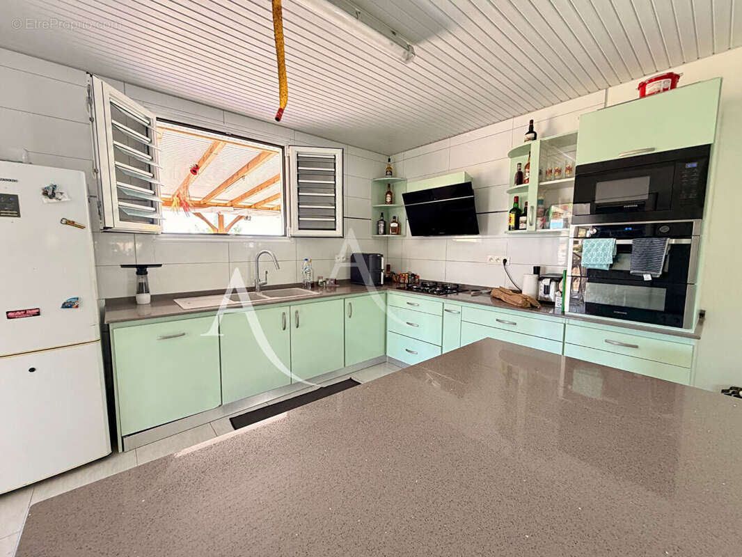 En EXCLUSIVITE: maison T4 + dépendance avec piscine au VAUCLIN. - photo 5