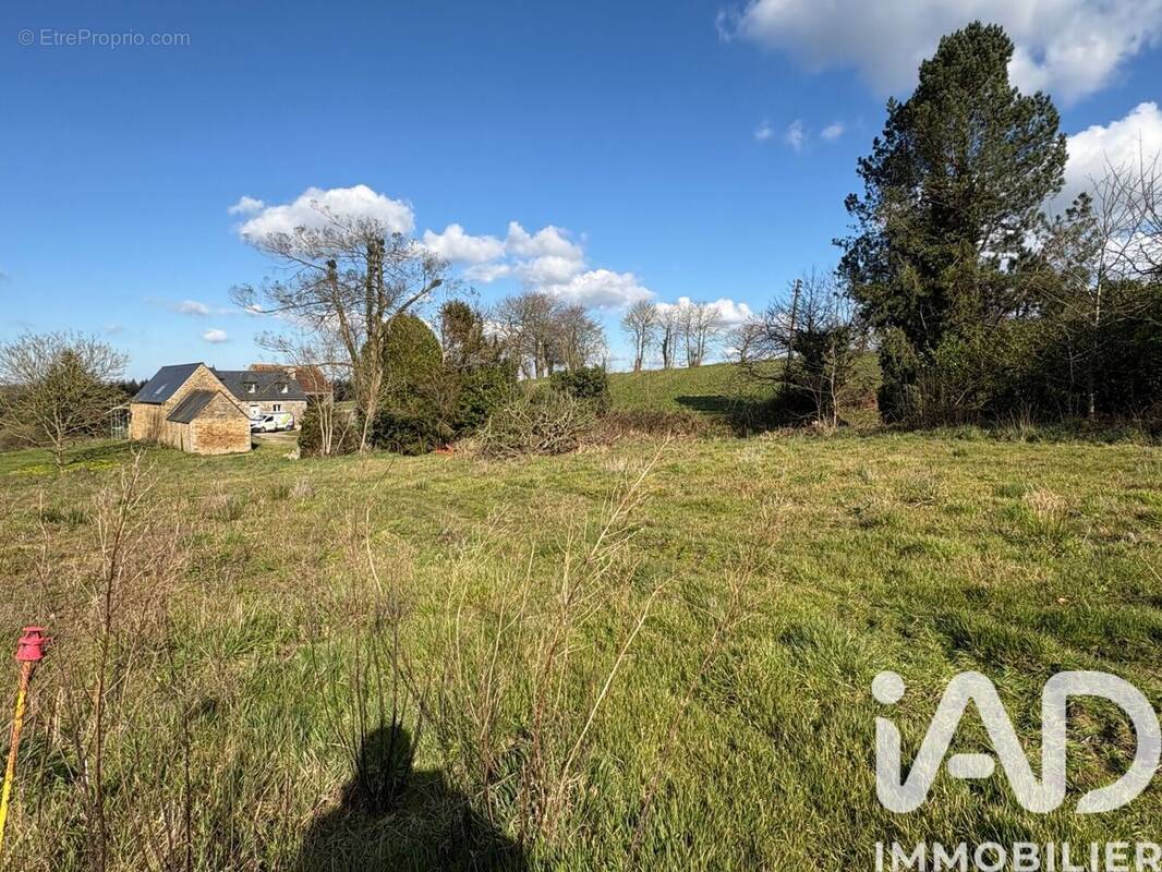 Photo 1 - Terrain à CAOUENNEC-LANVEZEAC