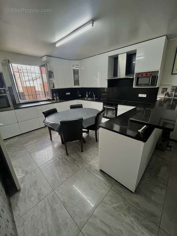 Photo 2 - Maison à AUBERVILLIERS