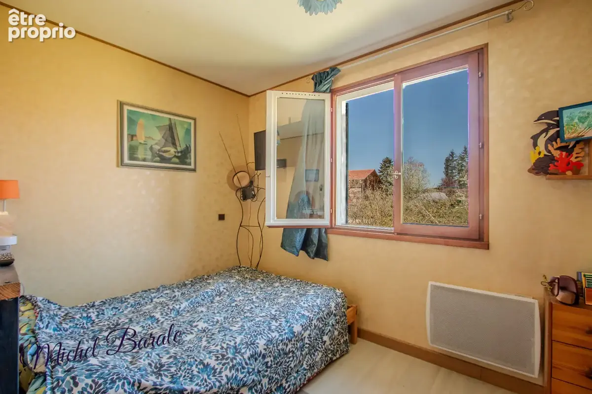 Maison de 78 m2 sur un sous-sol total implantée sur un terrain de 1200m2 à AVEIZE (69) - photo 6