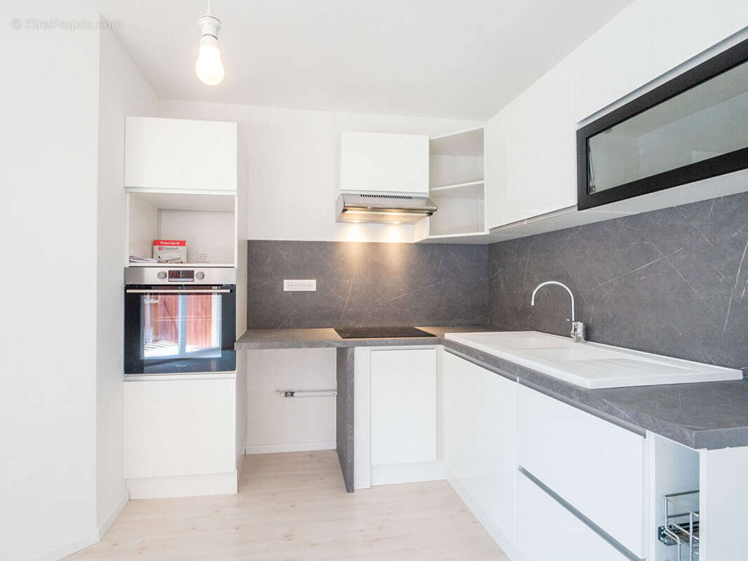 Laforet immobilier - "zinnia" - annecy - appartement 4 pièces - 68,27 m²  -  balcons - cave - parking de copropriete - photo 4
