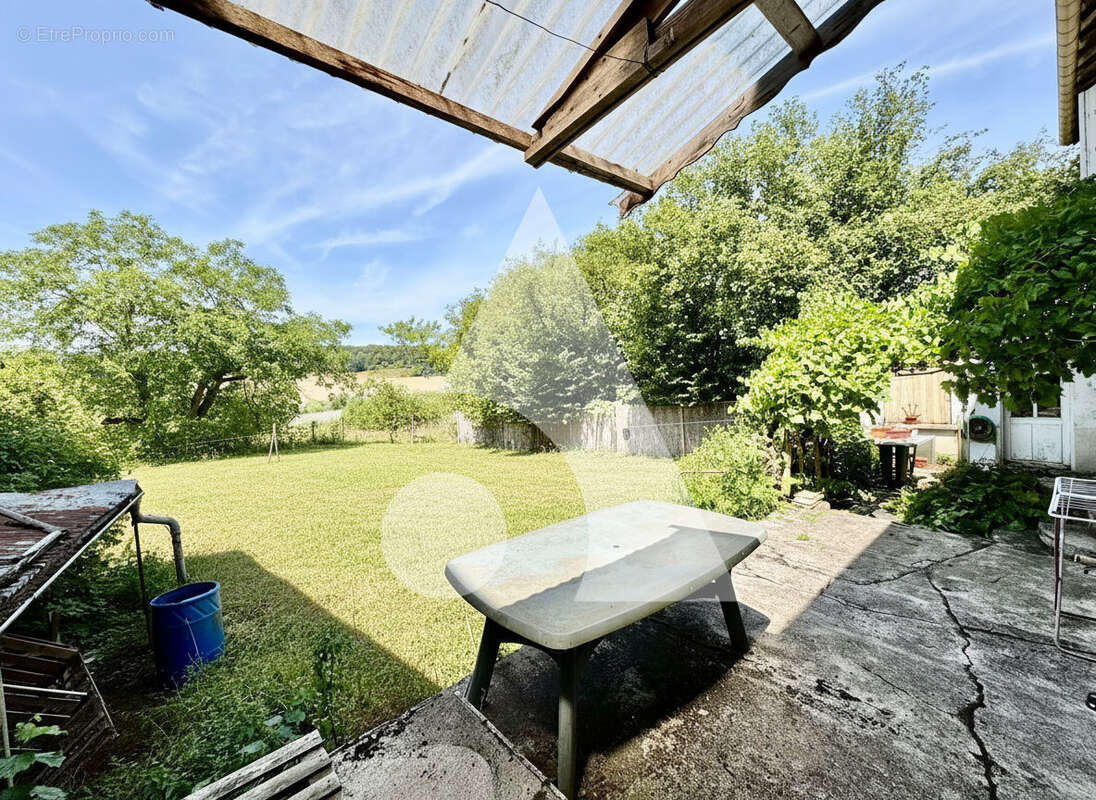 Agréable maison de village  avec garage et jardin à GONAINCOURT - photo 7