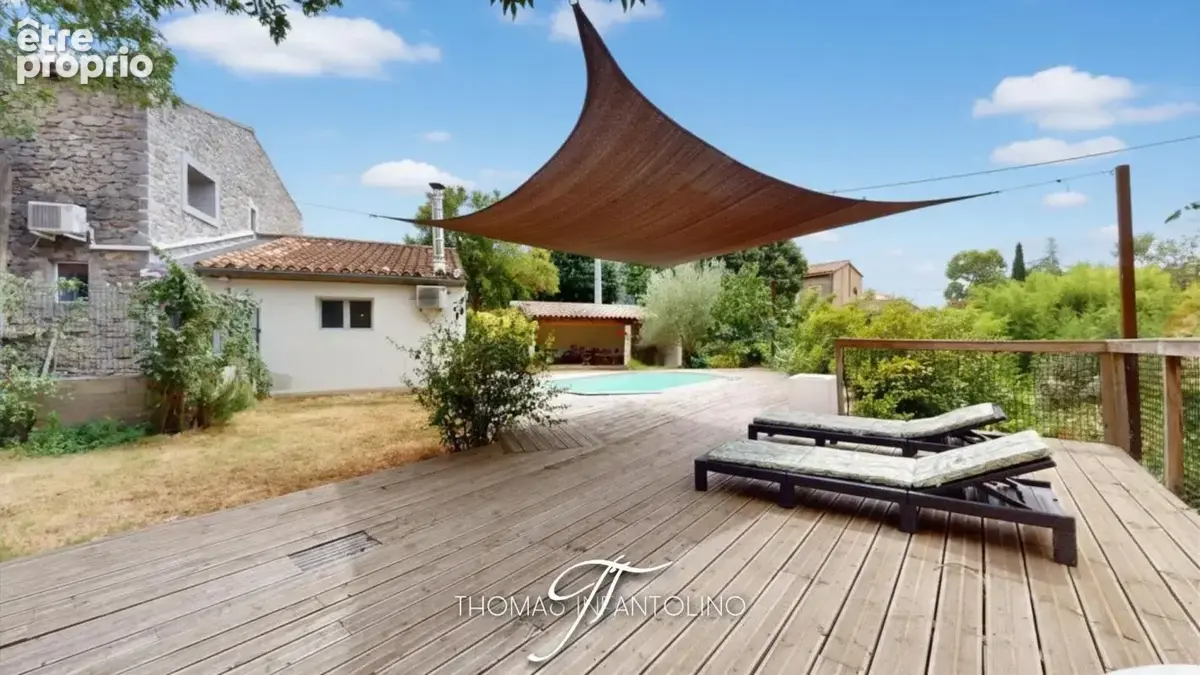 En exclusivite - maison en pierre - jardin - piscine - garage - climatisation - faible taxe foncière - photo 2