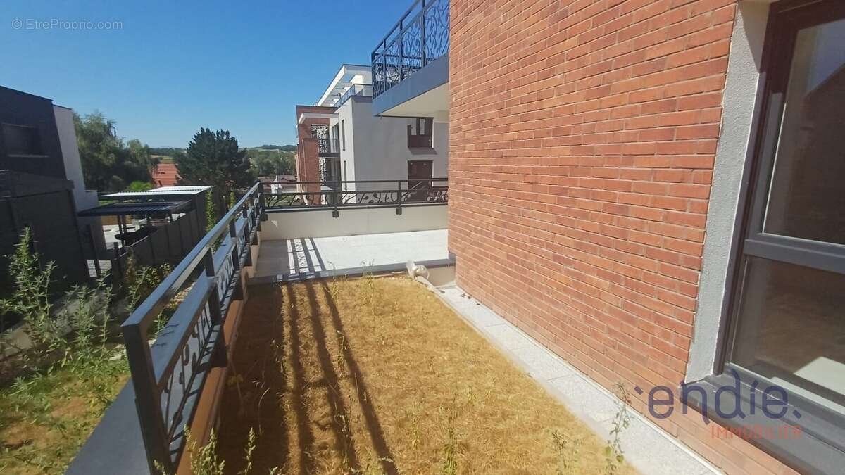 À 8 minutes de Sierentz  Superbe appartement 3 pièces avec terrasse et jardin privatif - photo 14