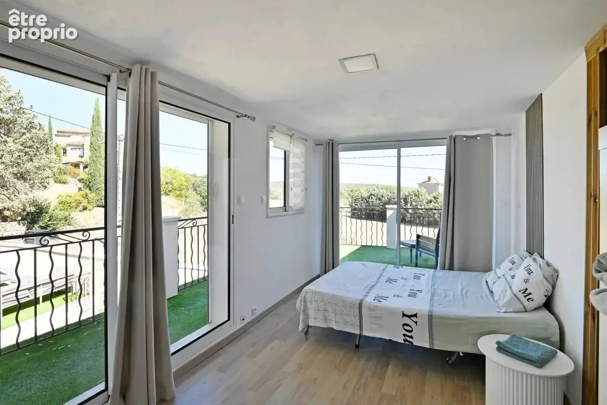 Maison de 5 pièces de 104 m² à Saint-Julien-les-Rosiers - photo 12