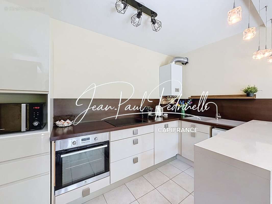 Tassin-la-Demi-Lune - Appartement 2 pièces de 48 m² avec balcon, parking privatif et cave - résidence sécurisée récente - photo 11