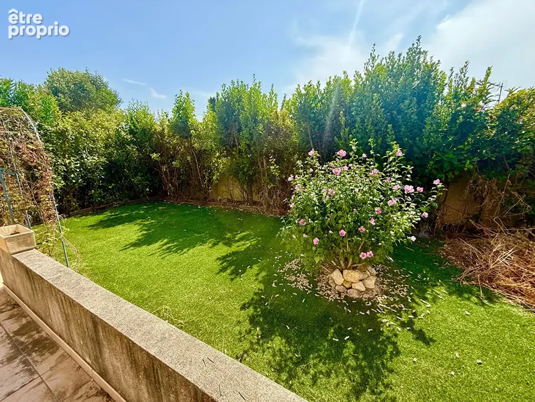 Appartement en rez-de-jardin avec terrasse et place de parking privative63,65 - photo 3