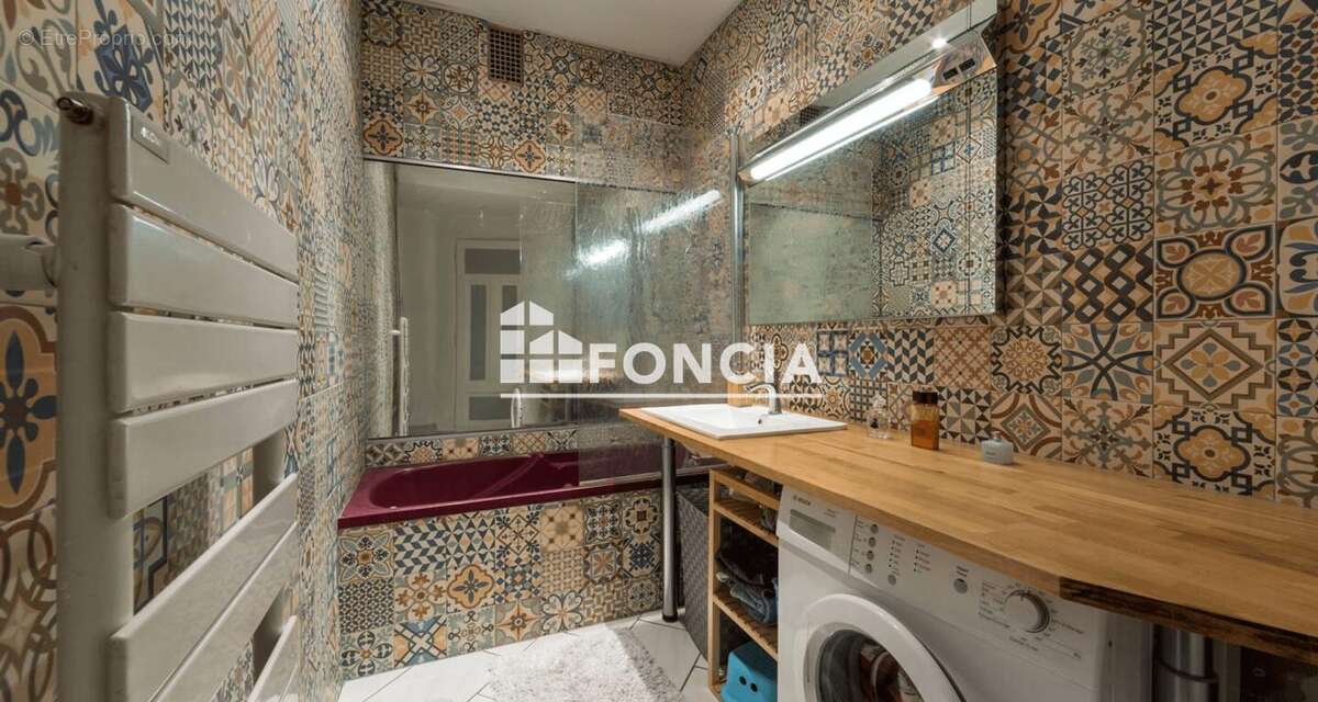 Annecy centre – T4 traversant de 84 m², balcons, parking et cave - photo 7