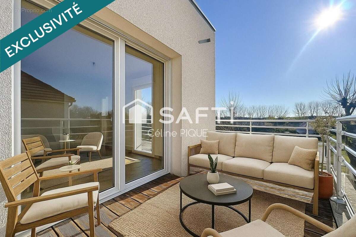 Photo 2 - Appartement à HEROUVILLE-SAINT-CLAIR