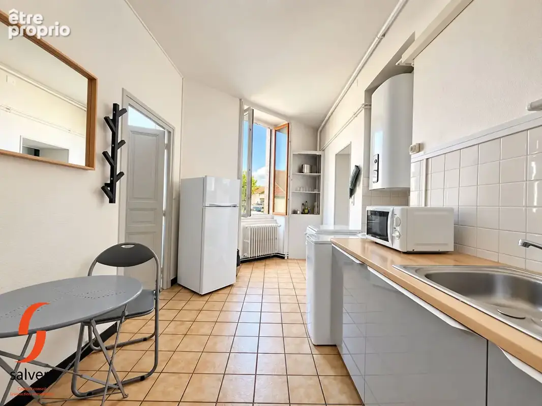 A vendre, Immeuble comprenant 5 appartements et 1 commerce. - photo 16