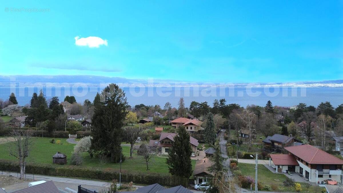 Maison_Chalet_Neuvecelle_Evian_Thonon_les_bains_proche_frontière_Suisse_Genève_villa_volume_commodité_architecte_Villa_lac_vue_leman_montagne_calme_lumineuse_véranda_ - Maison à NEUVECELLE