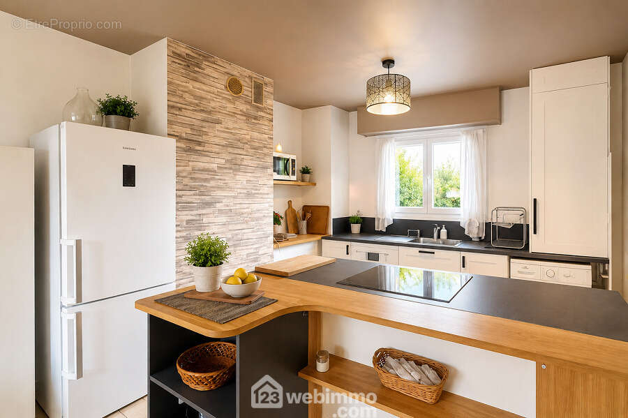 Cuisine ouverte moderne et fonctionnelle pensée pour un quotidien convivial. - Appartement à SAINTE-MAXIME
