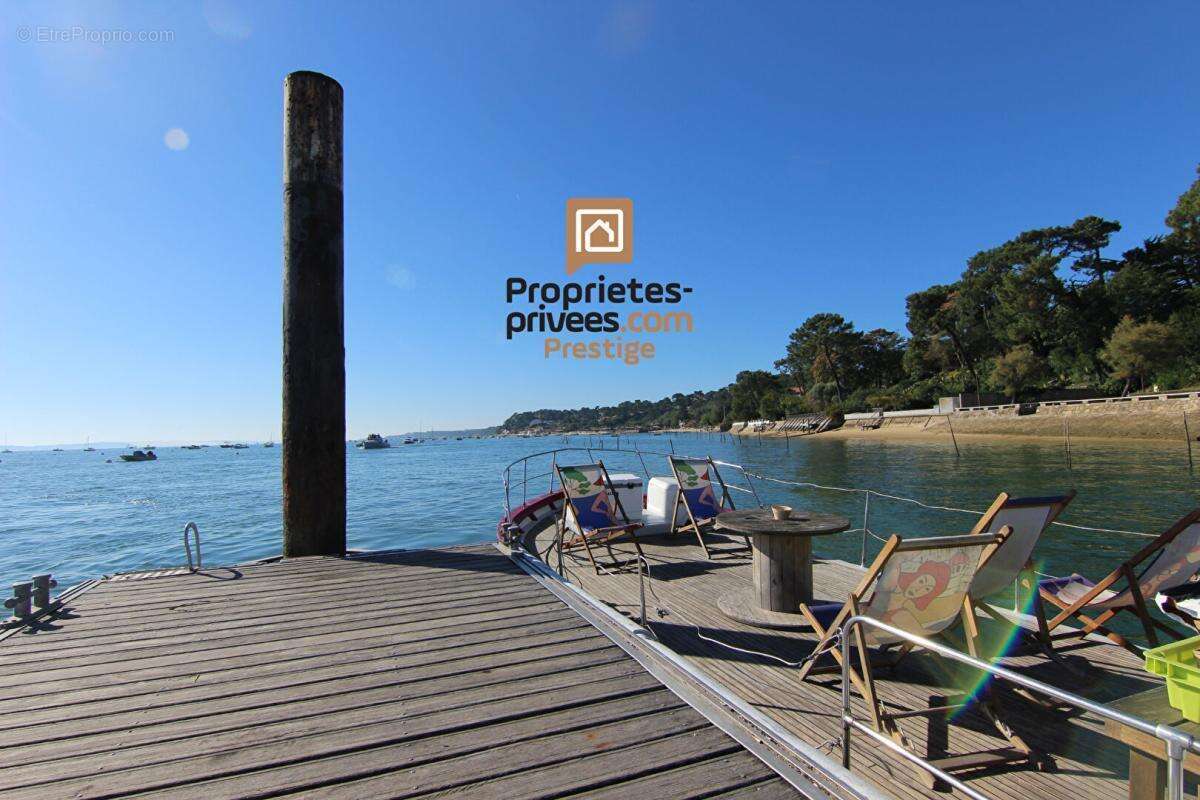 Dept 33 - CAP FERRET - LE CANON / PIRAILLAN - Maison Architecte Vue Mer 5 pièce(s) 113 m2 sur un terrain de 1187m2 - photo 4
