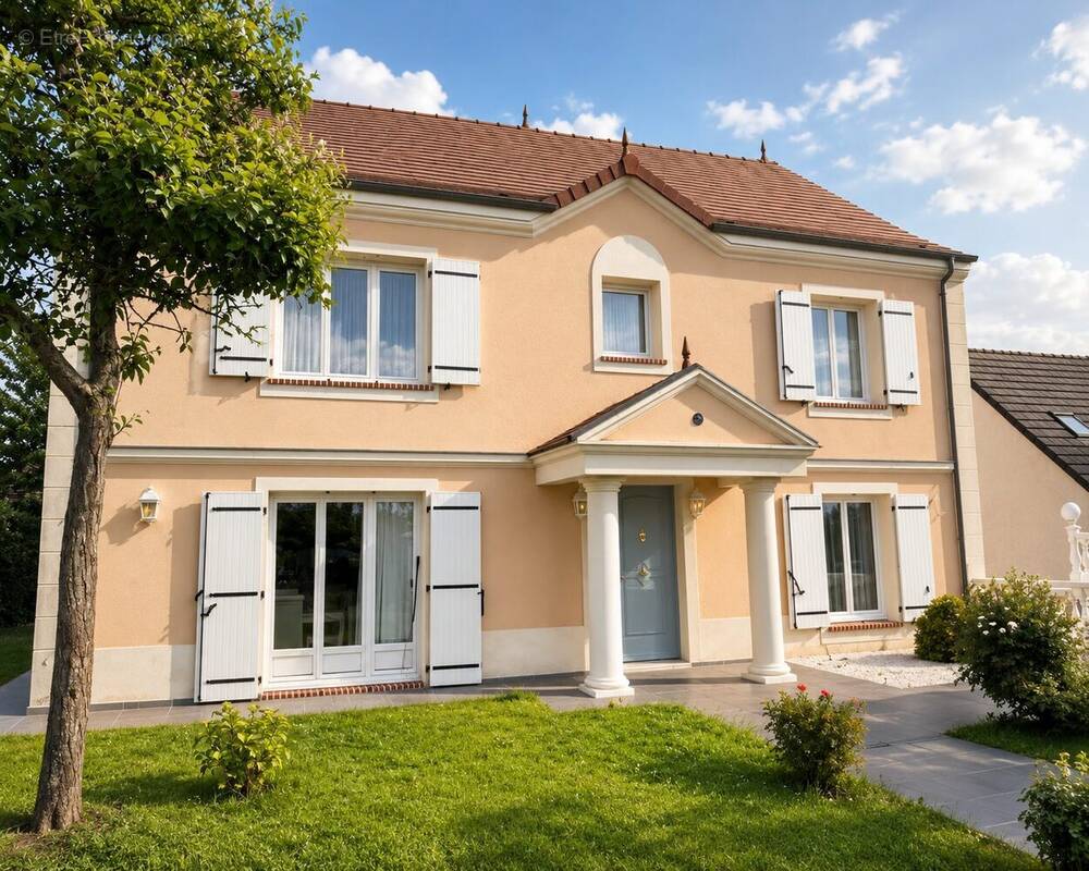 Façade élégante de cette villa familiale située à Val-de-Reuil, dans un quartier résidentiel calme et recherché. Maison de standing avec jardin soigné, stationnements privatifs et accès direct au sous-sol complet. - Maison à VAL-DE-REUIL