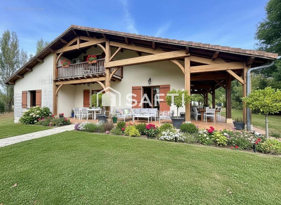 Photo 1 - Maison à BEAUZIAC