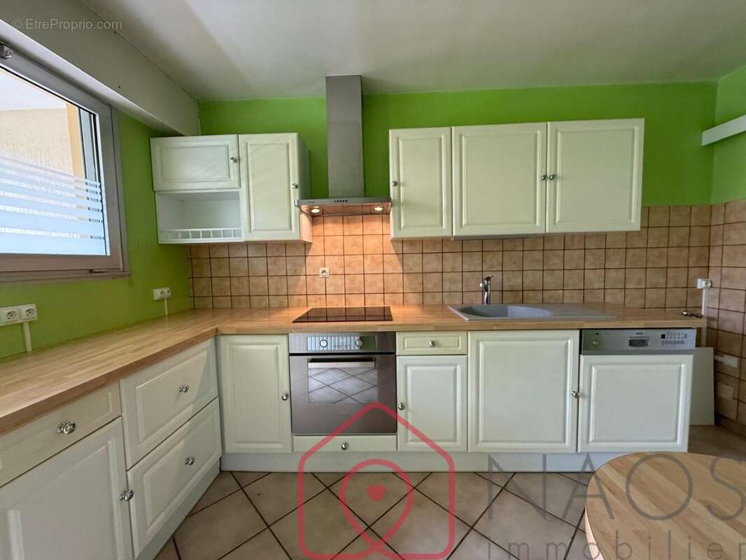 Appartement t2 en rez-de-chaussée avec balcon filant, cave et stationnements - photo 5