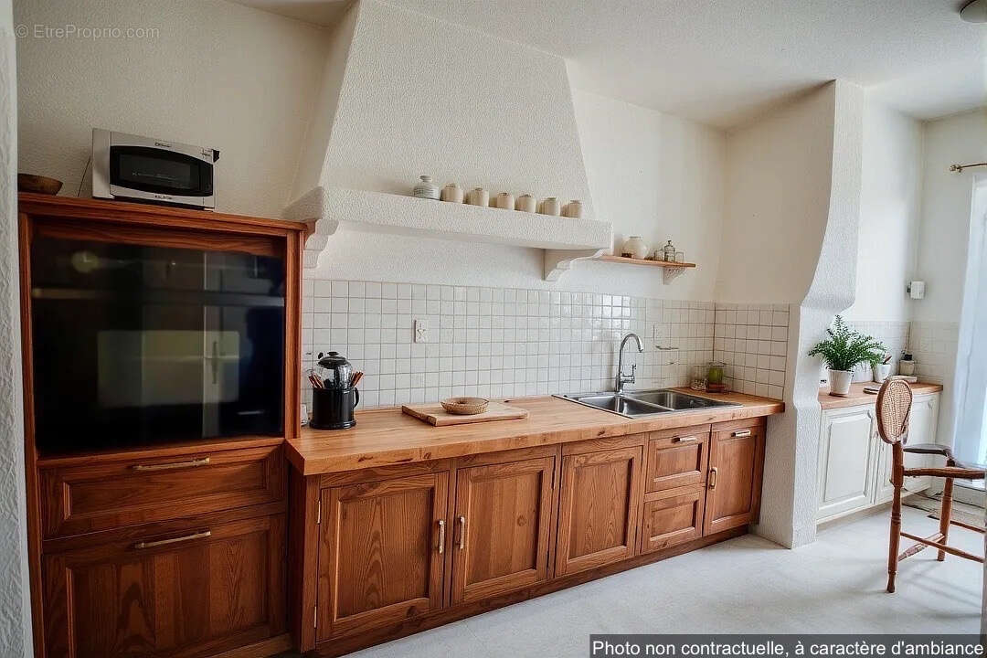 Maison à LAUDUN-L&#039;ARDOISE