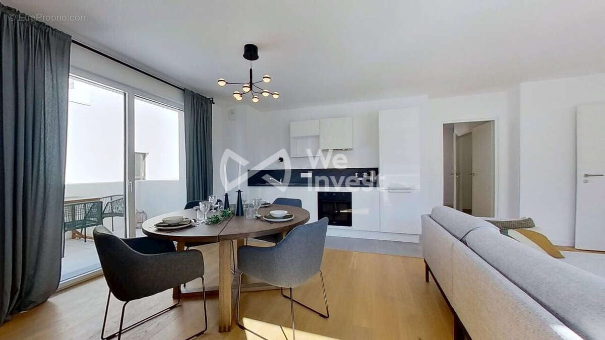 Séjour avec cuisine aménagée et équipée - Appartement à NANTES