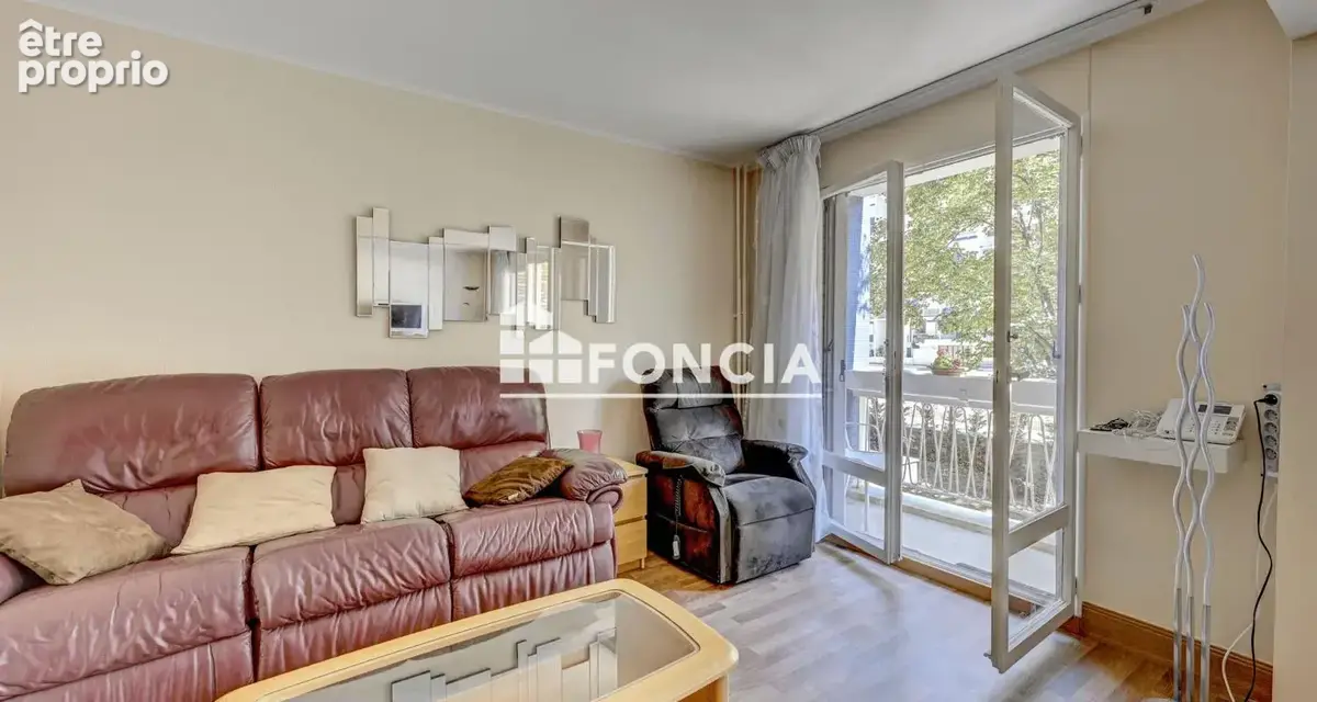 Appartement familial avec balcon ,cave et parking - photo 3